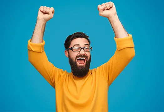 Man with arms in the air celebrating no guarantor car finance approval